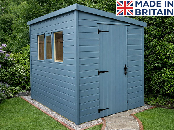 A blue lean-to shed with windows and doors in a garden. Showing optional paint finish.