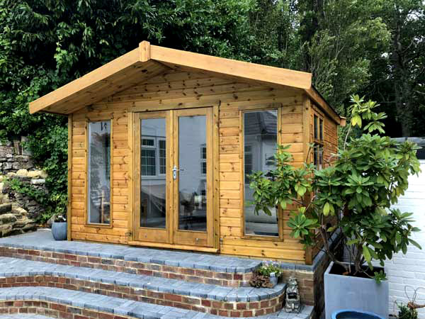 A wooden summerhouse with double doors and windows. Perfect for storing gardening tools and outdoor equipment.