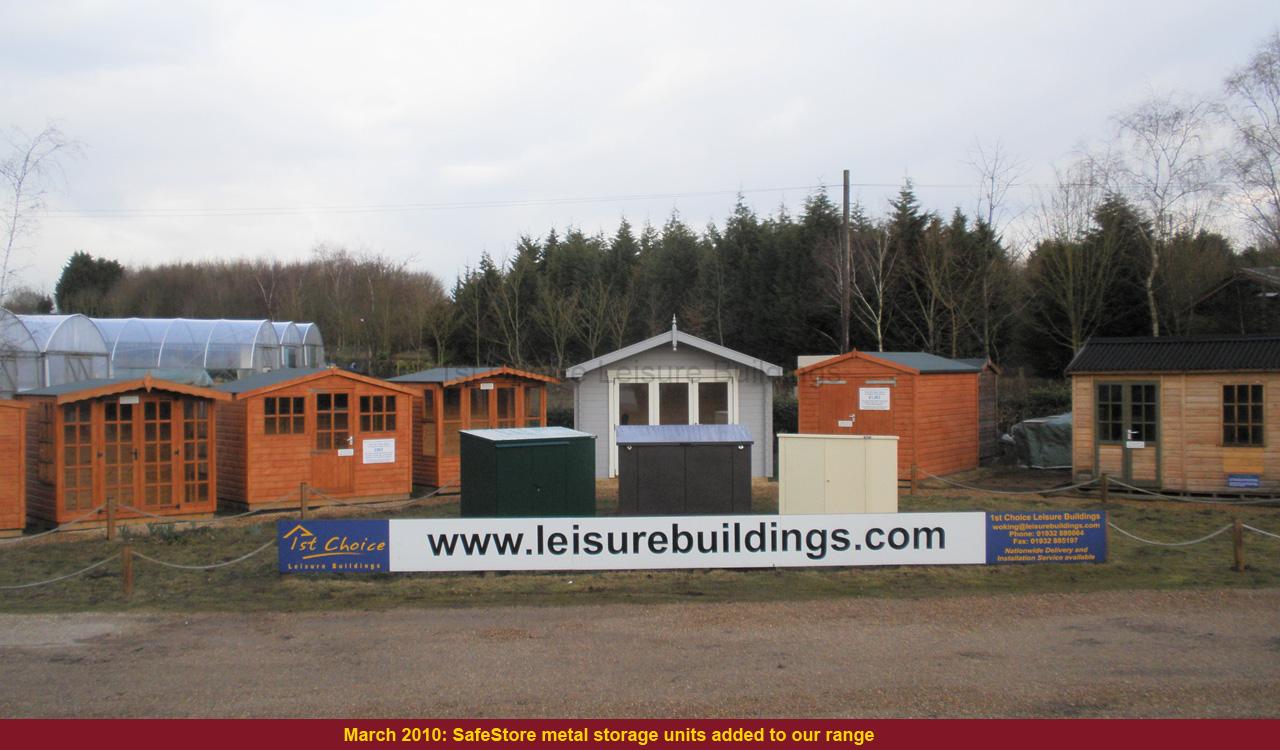 Garden buildings on display A row of wooden garden sheds and storage units for sale
