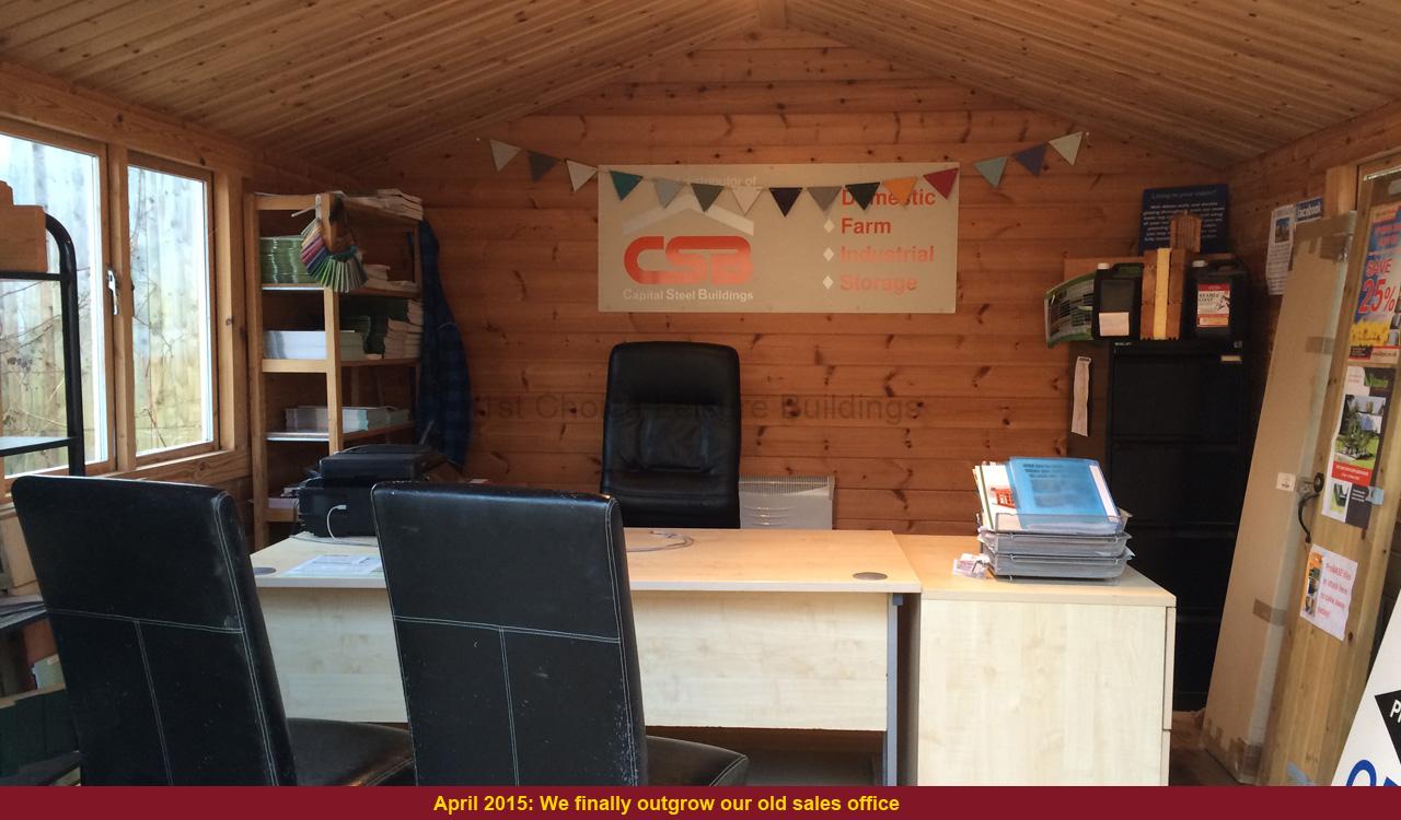 office with desk and two black chairs a wooden office with a desk and black chairs