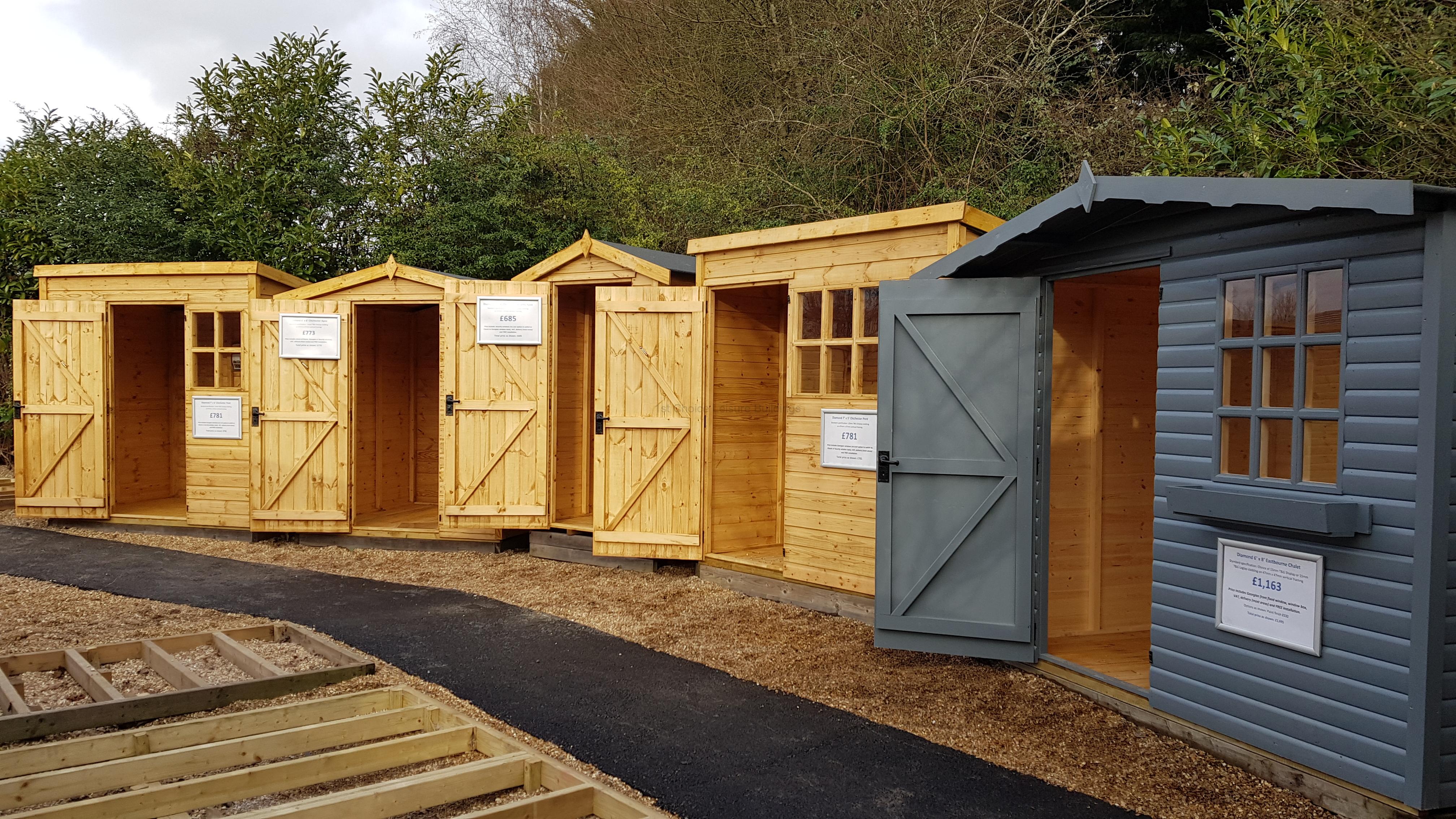 Wooden garden sheds for sale A row of wooden garden sheds