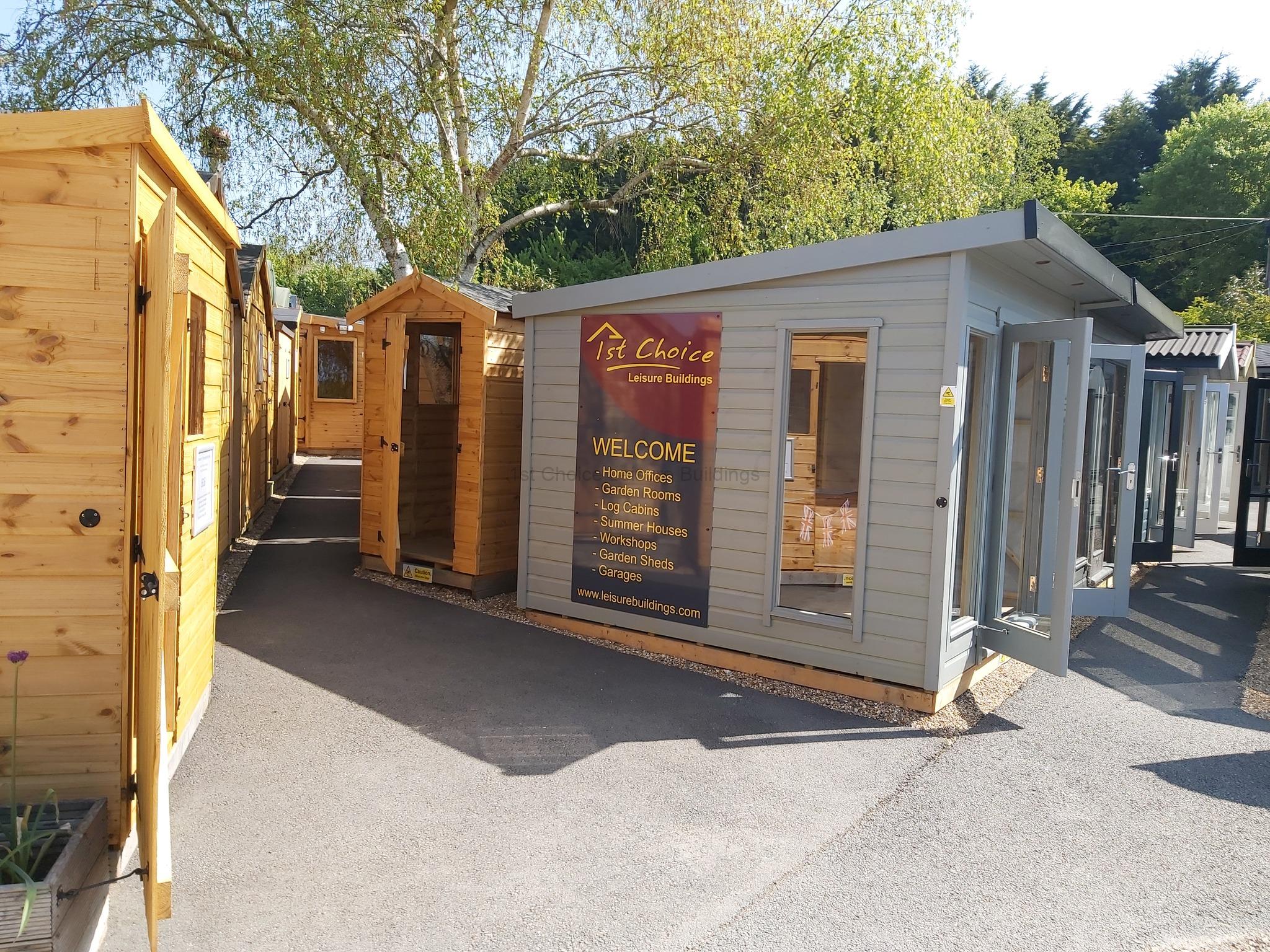 Row of garden buildings for sale UK A row of wooden garden buildings with open doors