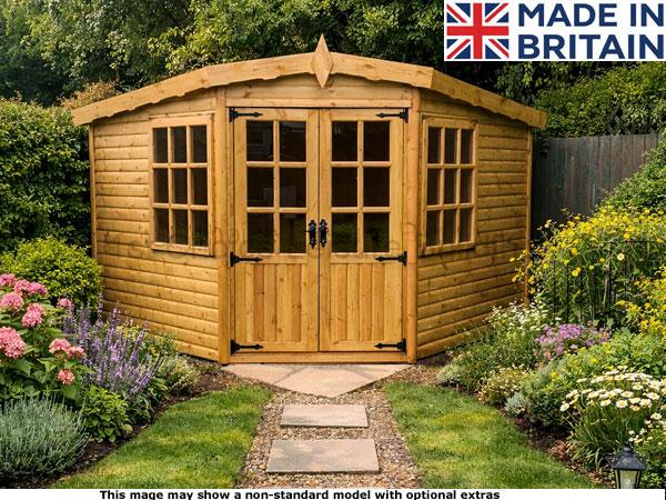Diamond Worthing Corner 1 A wooden garden shed with double doors and windows, surrounded by a beautiful garden.
