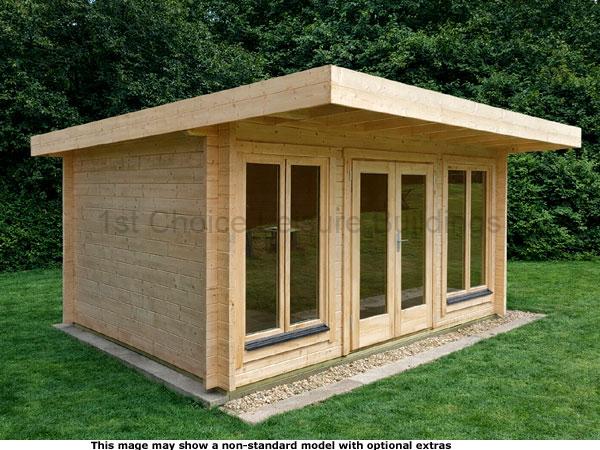 Dorking Pent Cabin 1 A modern wooden garden log cabin with large windows and a flat roof. The shed has a natural finish and is situated on a concrete base surrounded by grass.