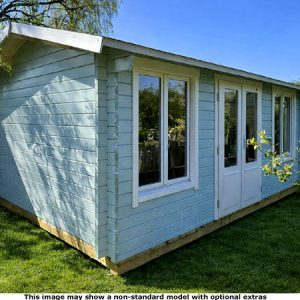 A garden log cabin with light blue wooden walls and white trim around the windows and doors. The shed has a sloping roof and is situated on a grassy lawn.