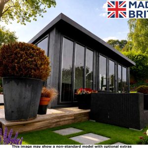 Royal Buckingham 12x12 Garden Room with large windows and a patio area. The room is made of dark wood and glass.