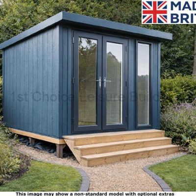 A blue garden shed with wooden steps and glass doors. A garden surrounding the shed.