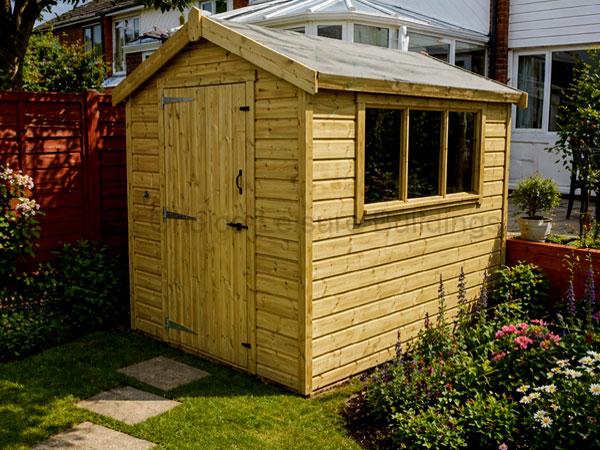 Sapphire Swanwick Apex 1 A wooden garden shed with a window and single door in a backyard garden. The shed is made of light-coloured wood and has a sloping roof.