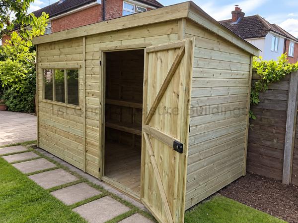Wooden garden shed with sloped roof, window, and double door in a fenced garden
